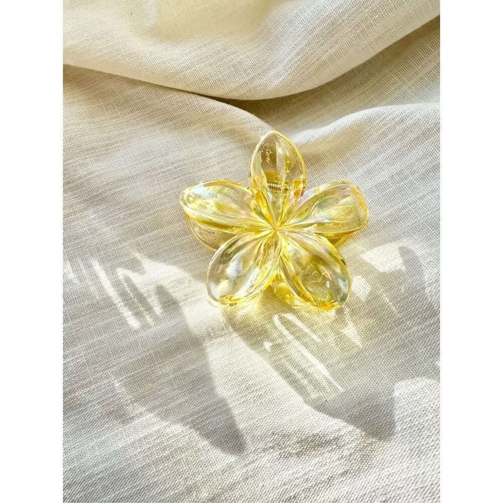 Iridescent and Translucent yellow plumeria hair claw ￼